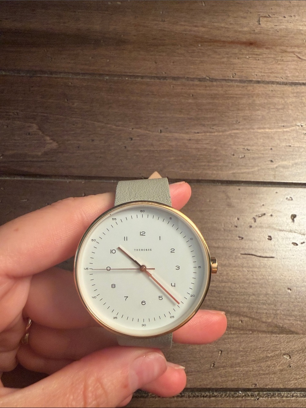 The Horse Gold Case Watch with Light Gray Strap and White Dial